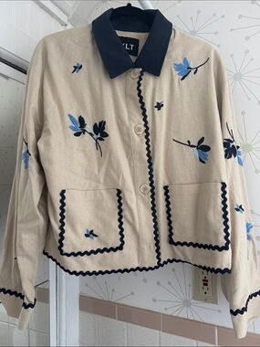 NVLT Beige Jean Jacket with Navy Trim and Blue Floral Embroidery